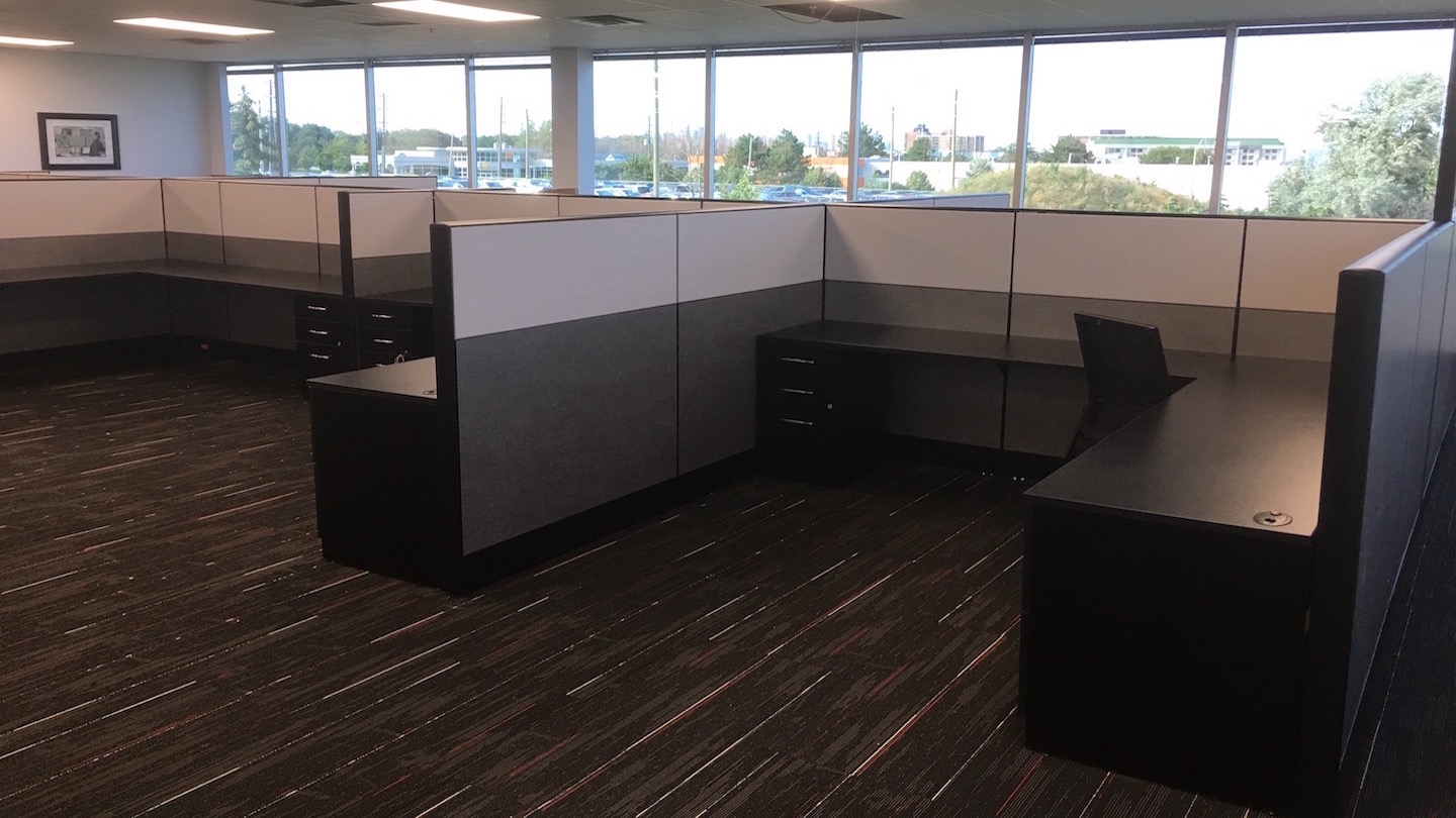 Cubicle walls and desks installed in the empty office.