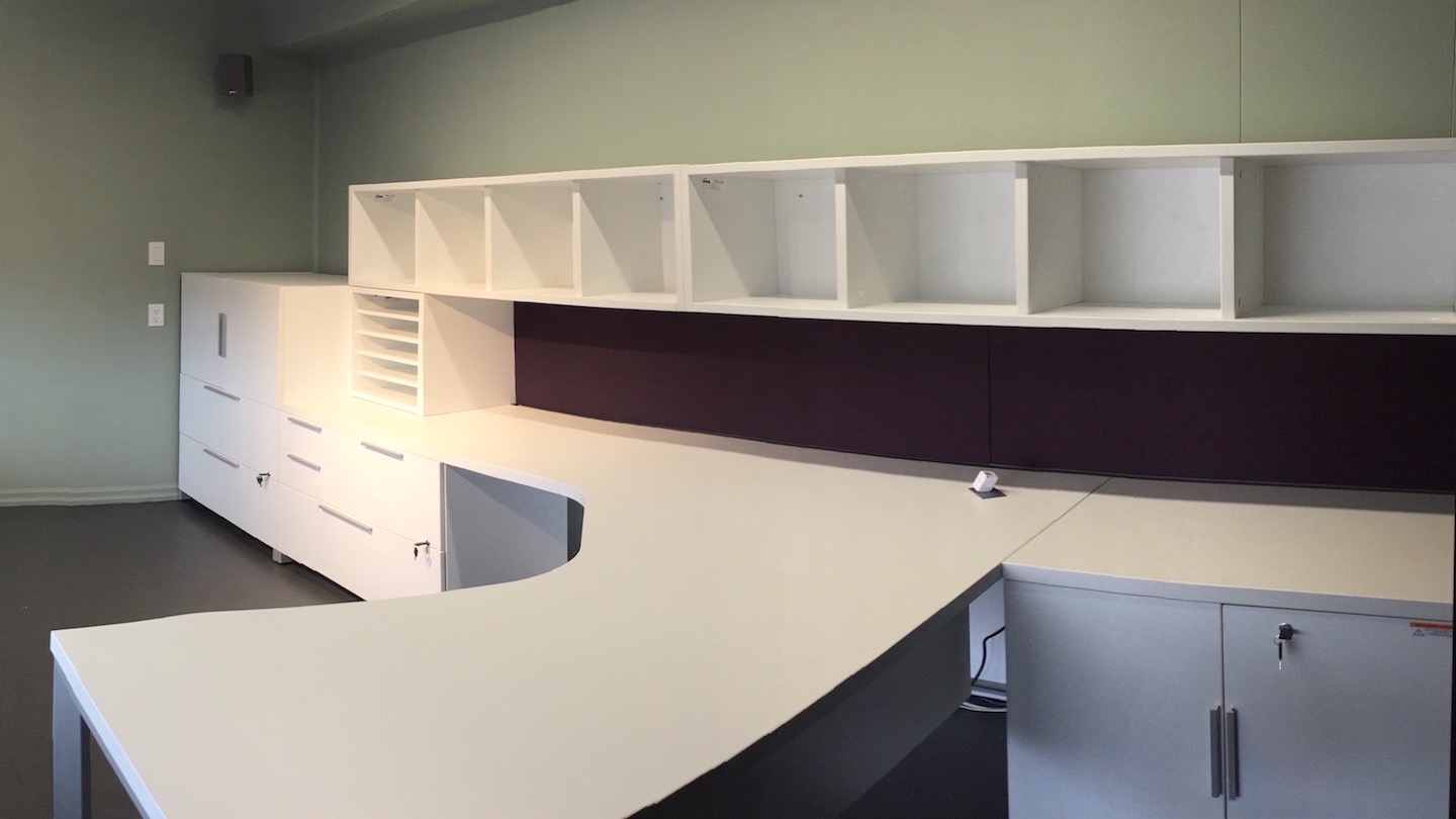 An office desk and shelf set delivered and installed for a personal office.